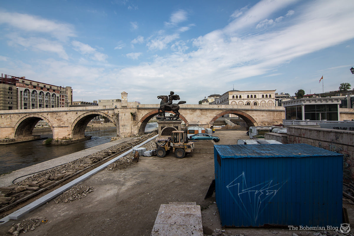 The 'Monument to Karposh' watches over a construction site in central Skopje. Below: The project continues.