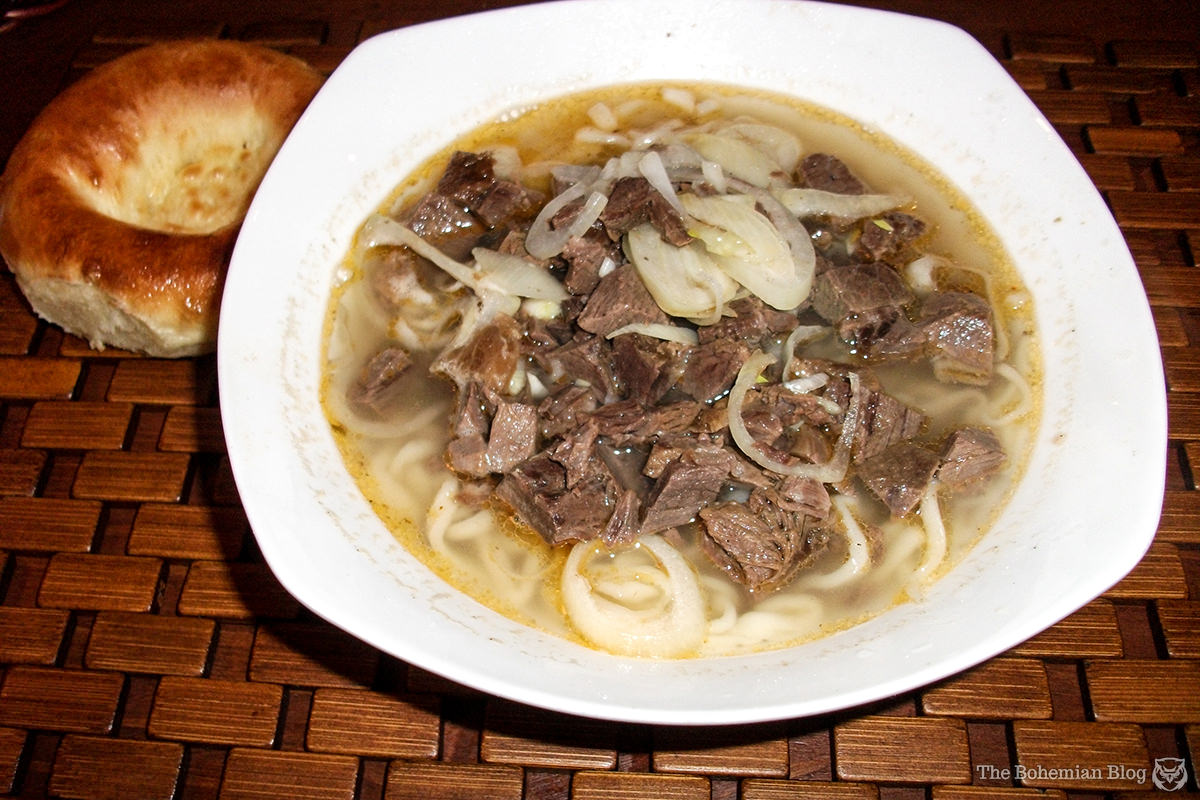 Another staple of Kazakh cuisine: Laghman noodle soup, served here with horse meat and salty doughnuts.
