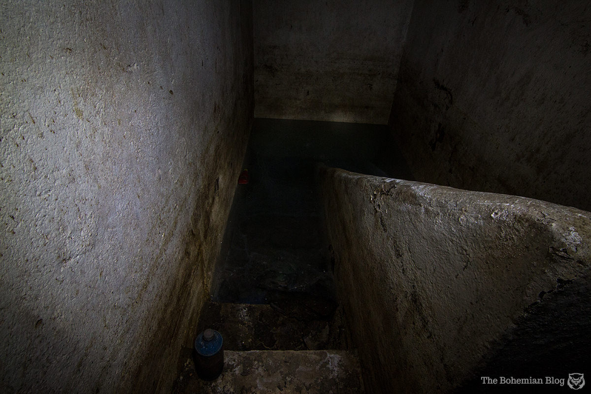 In another room this staircase to the second level is lost beneath floodwater.