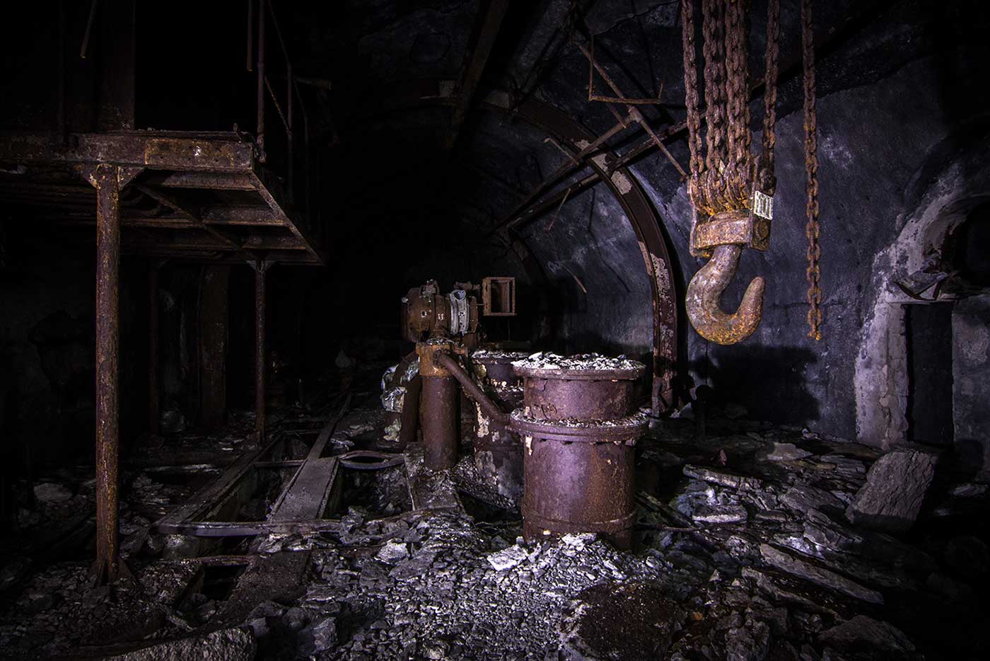 While the main galleries of the Željava Airbase have mostly been stripped bare, smaller side passages lead deeper into the mountain, to spaces that still contain rusted machinery and other original features.