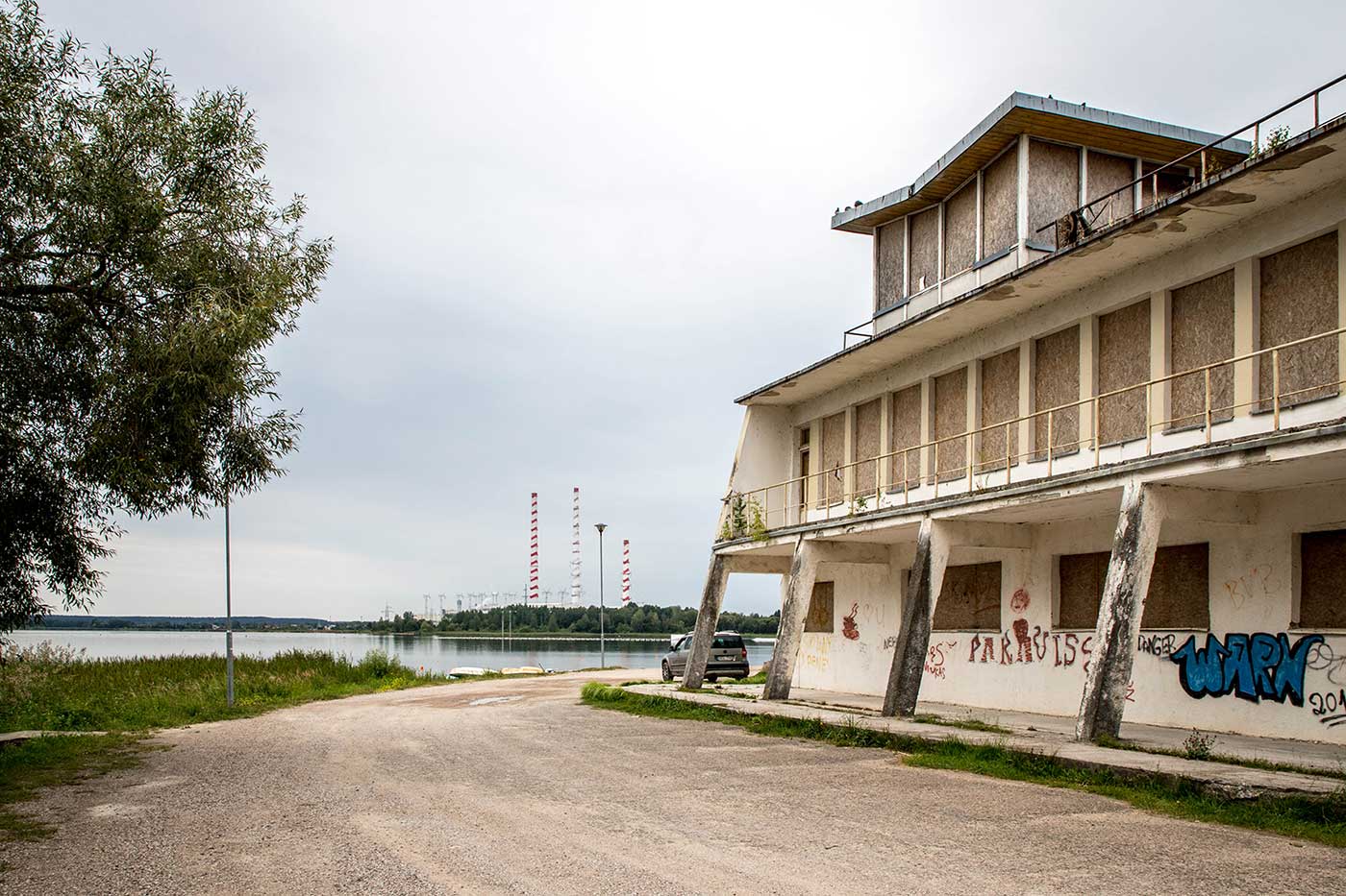 Beyond this building lies Elektrėnai Beach – where in summer, citizens can swim in the cooling reservoir, overlooked by the power plant's chimneys. Elektrėnai, Lithuania.