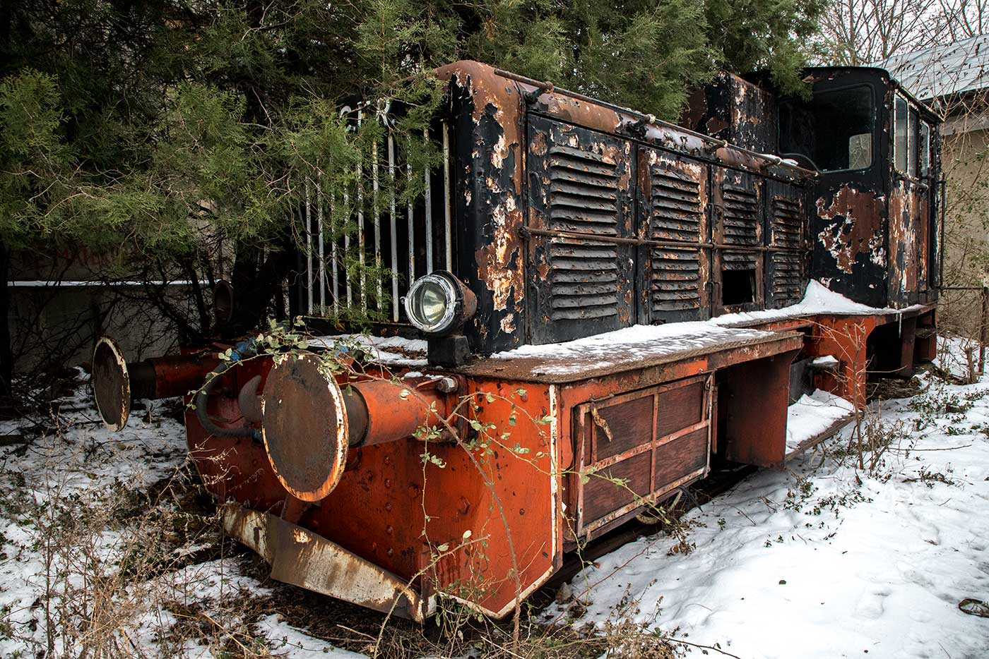 Near the train hangars, this engine is in the process of being absorbed into the undergrowth.