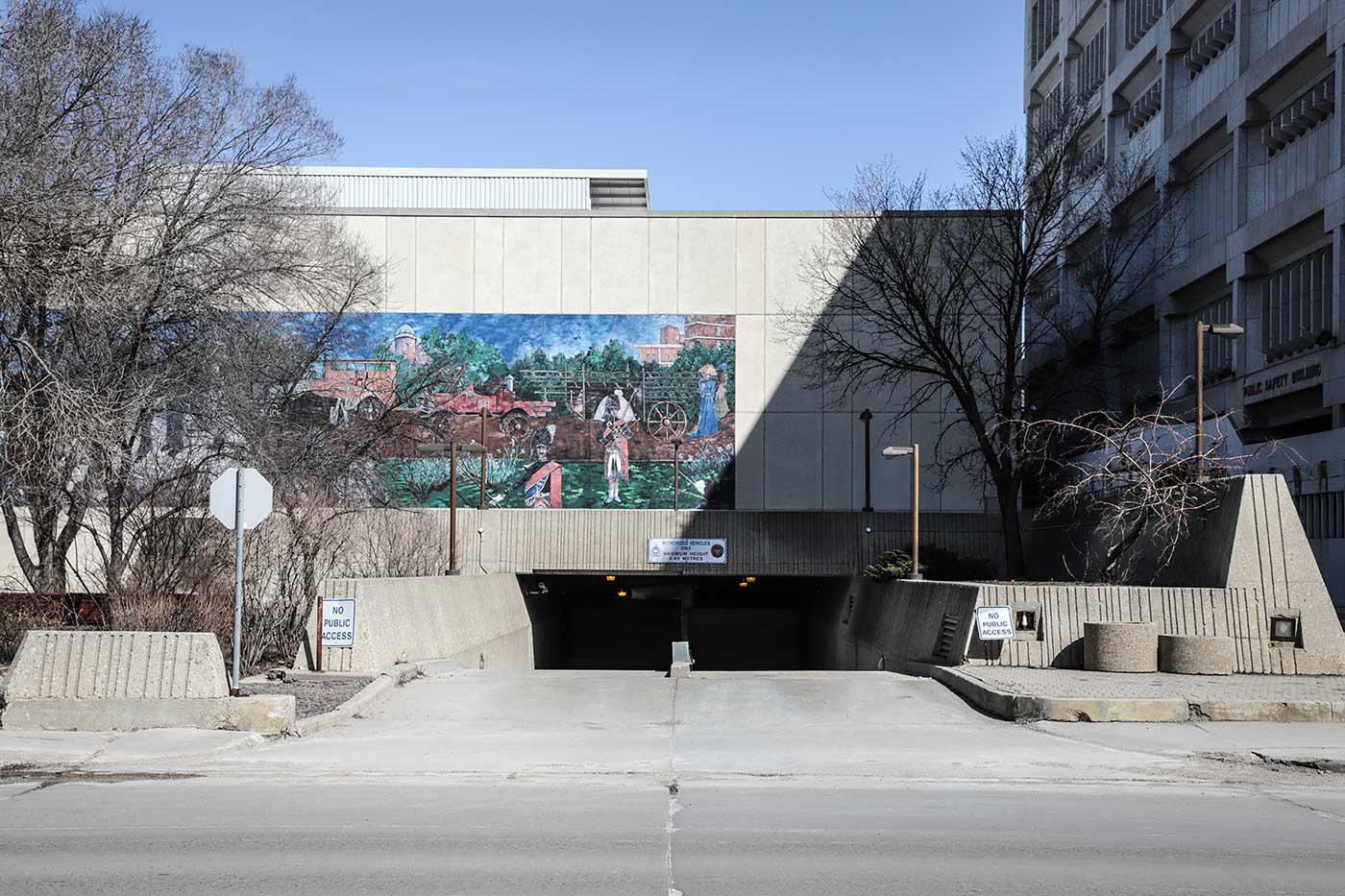 A mural decorates the wall above the entrance to the Public Safety Building's underground parking space.