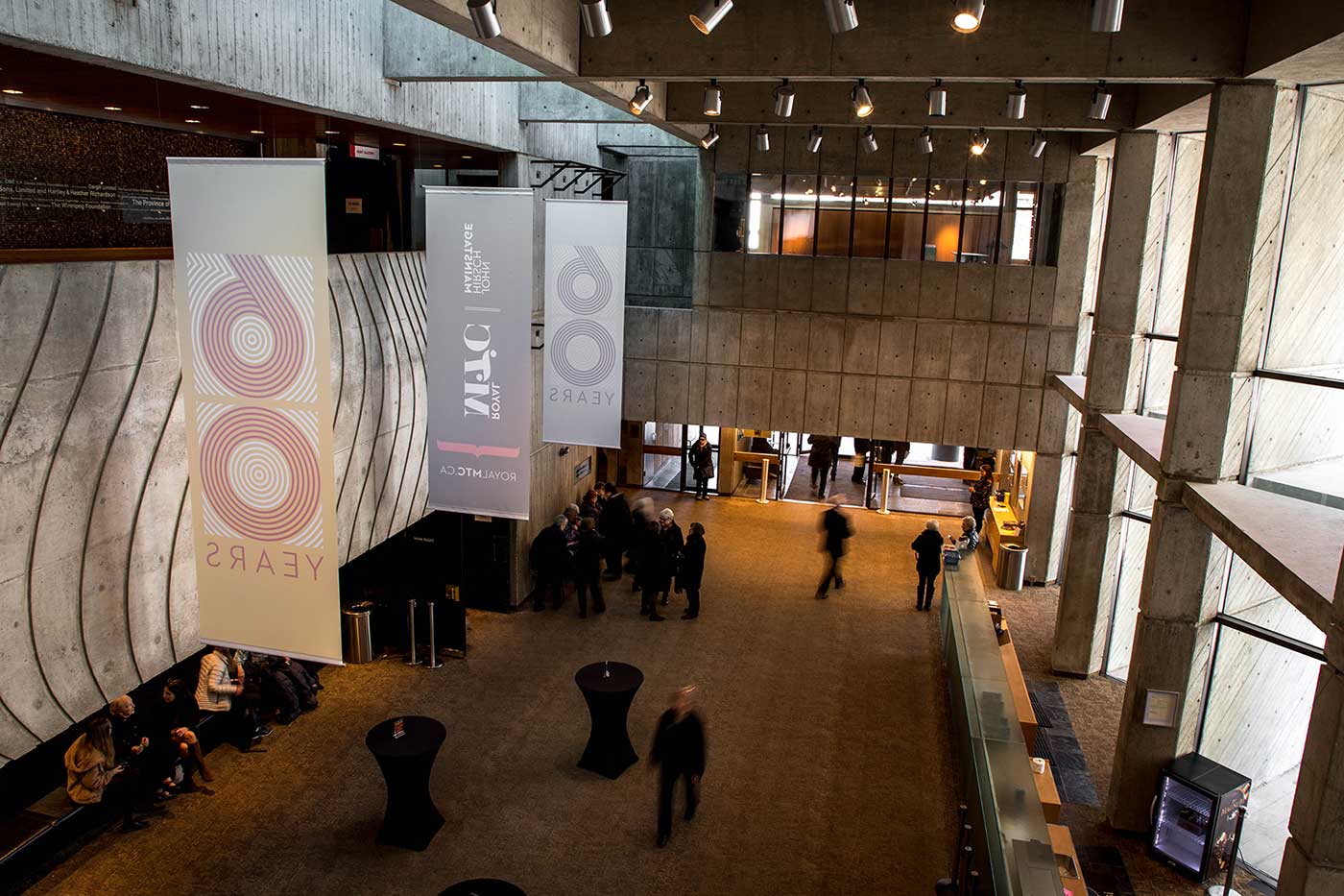 View of the north lobby inside the Royal Manitoba Theatre Centre, from a balcony above.