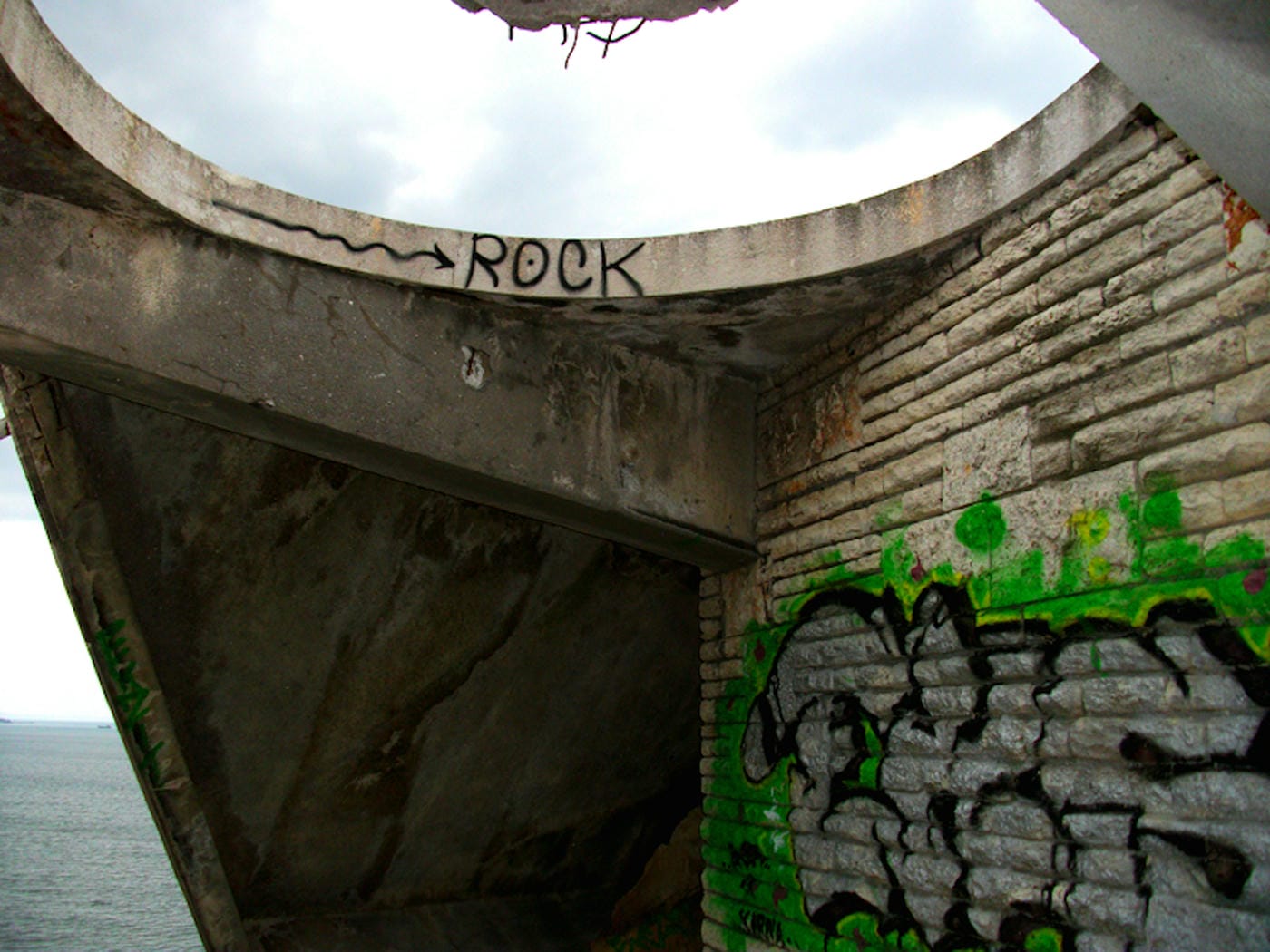 The fallen restaurant: exploring a ruin with a view on the edge of a cliff high above the Bulgarian Black Sea